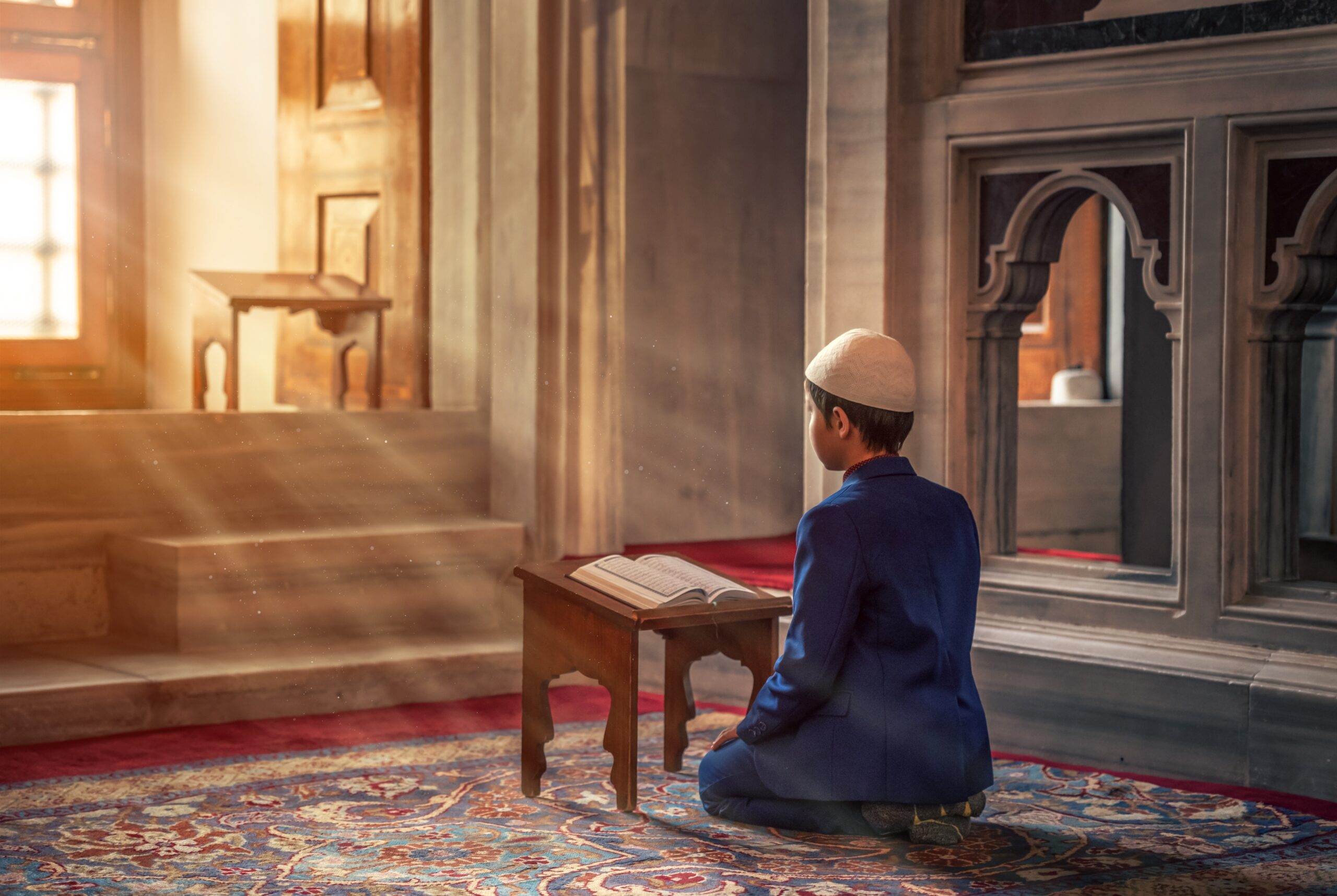 Kid reading and memorizing the Quran